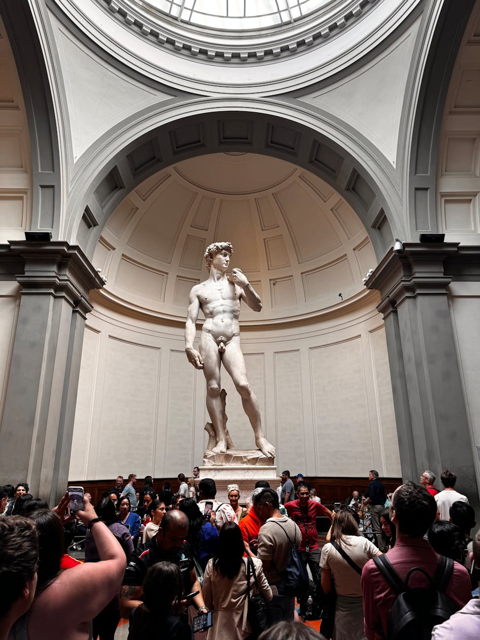 tourists in front of david statue in galleria dell accademia in florence