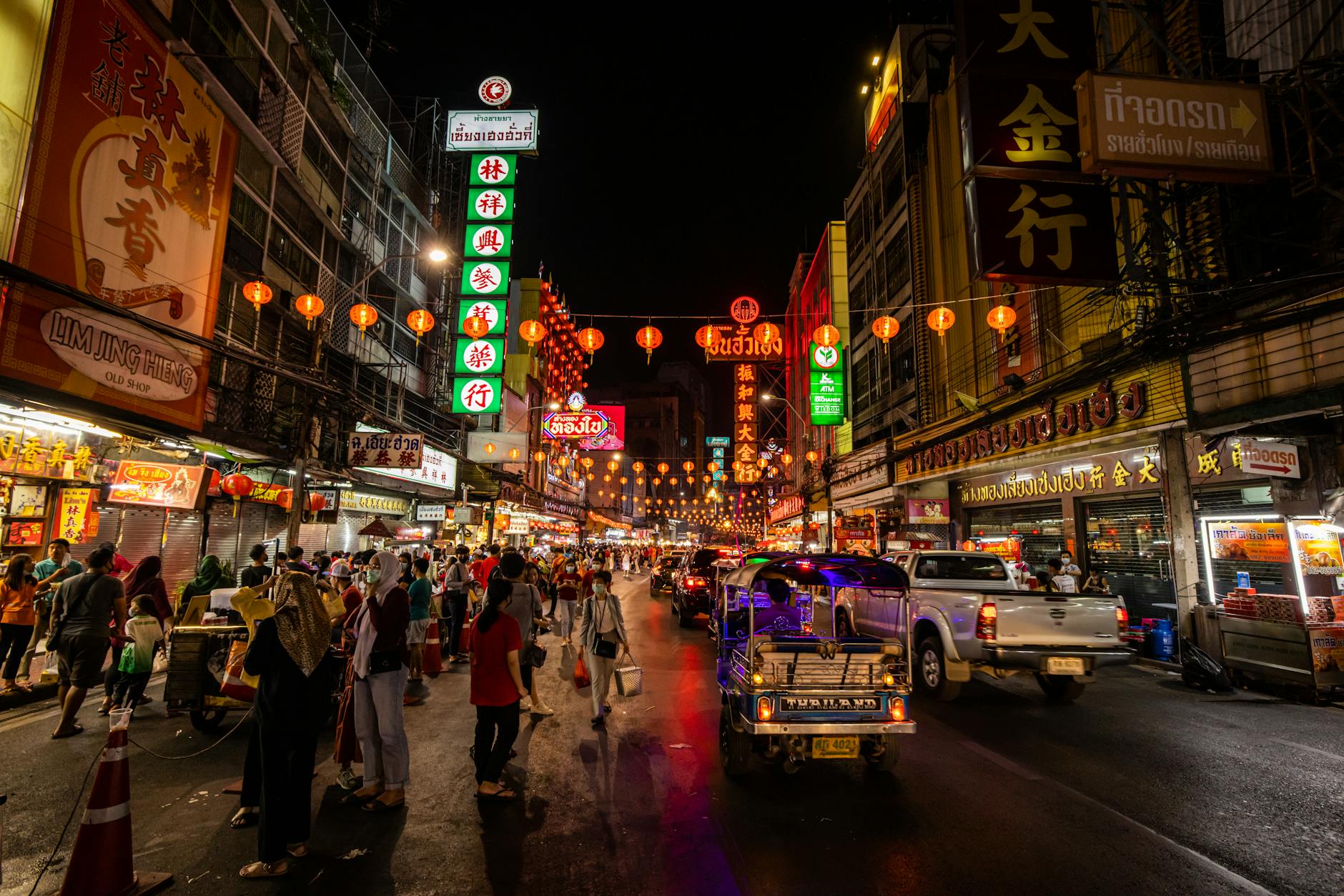 people walking on street during night time